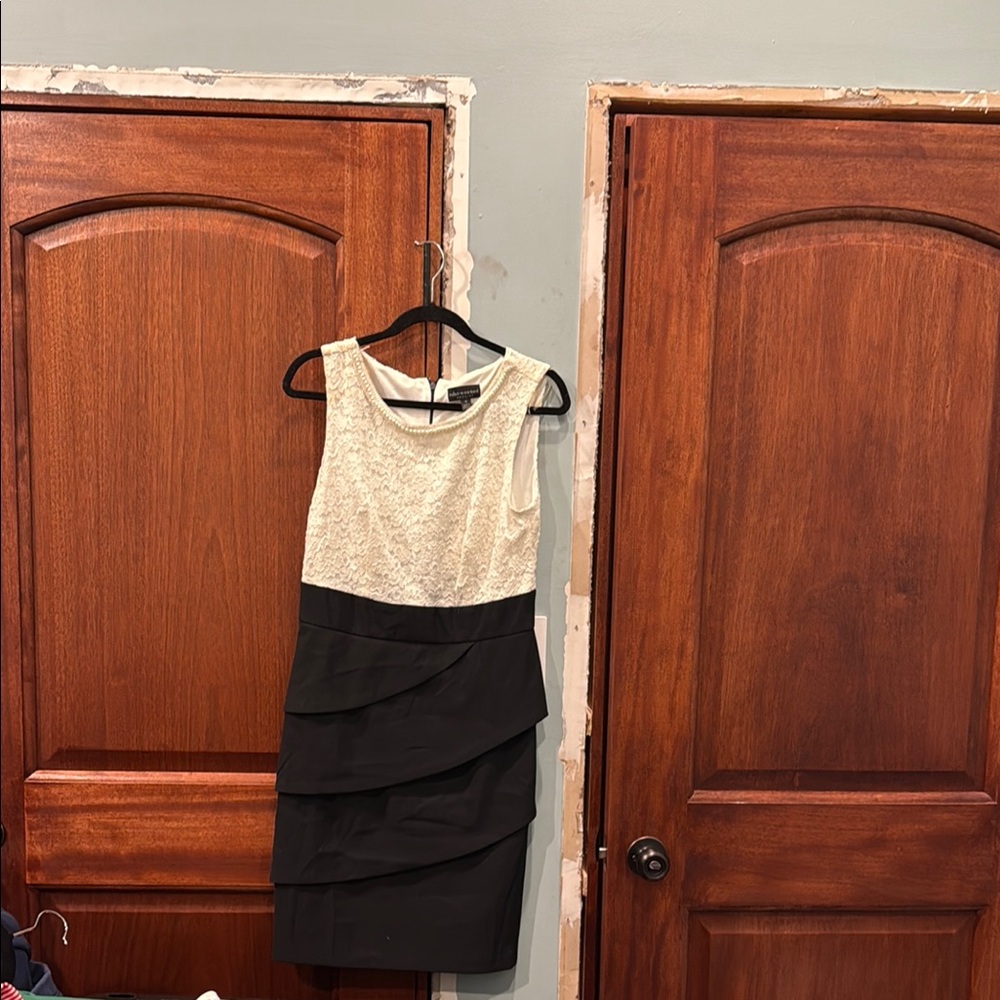 Elegant Black and Cream Sleeveless Dress with Pearls